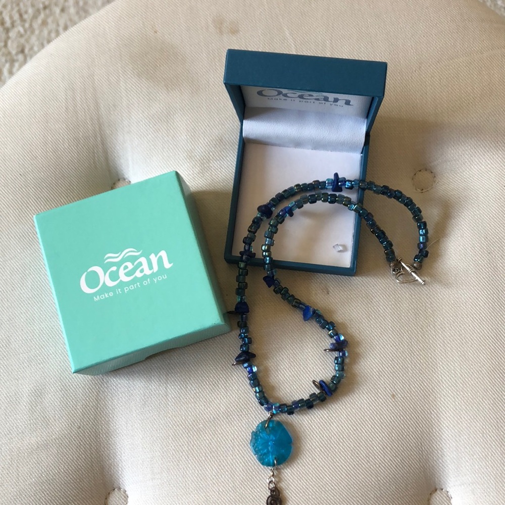 Blue bead necklace with sand dollar charm